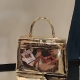 AT059L, The Kelly, by Tessi, gold chrome, 35x12x34cm.